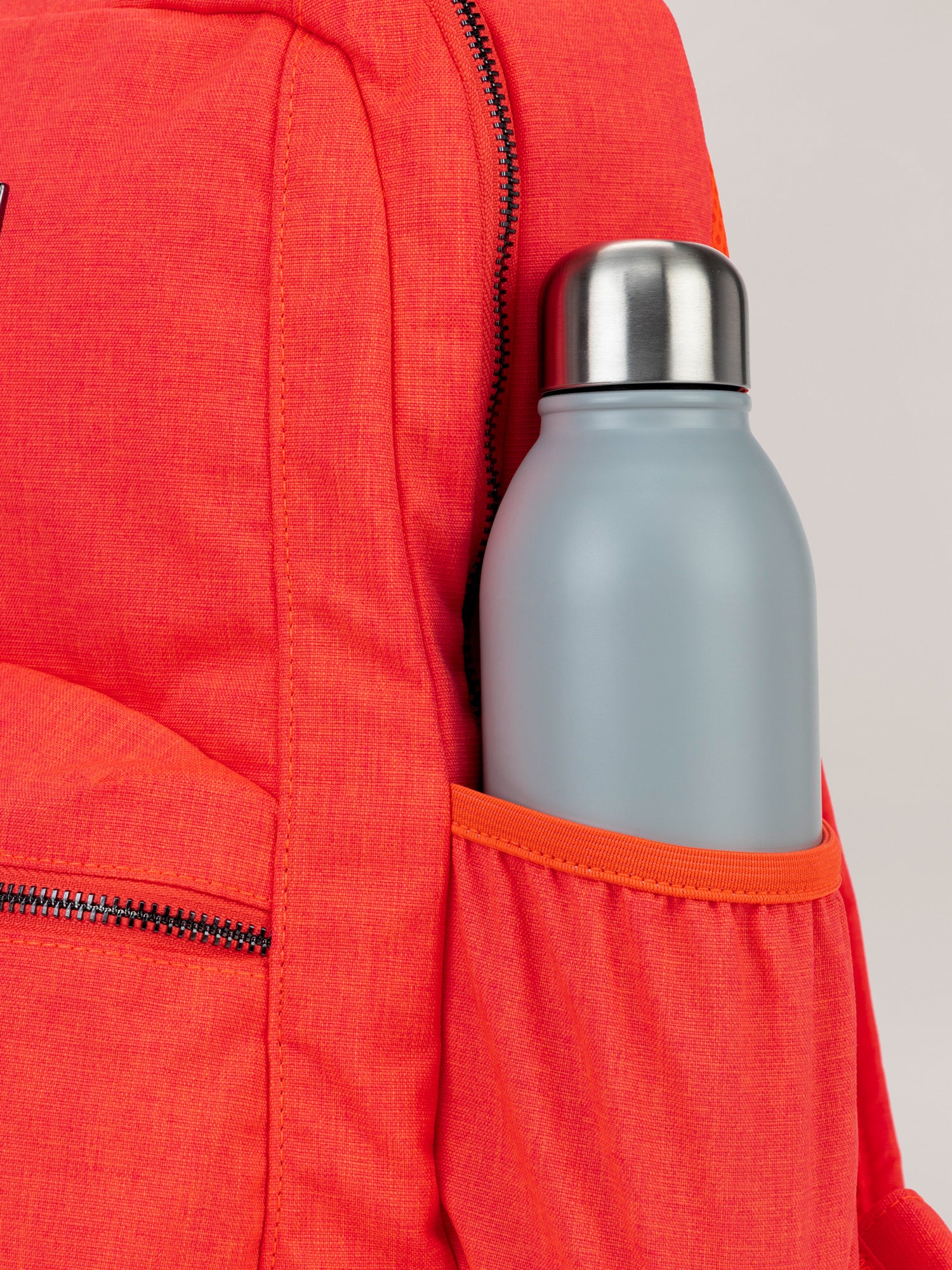 Neon Coral Be Packed Backpack Bottle Pocket Detail View