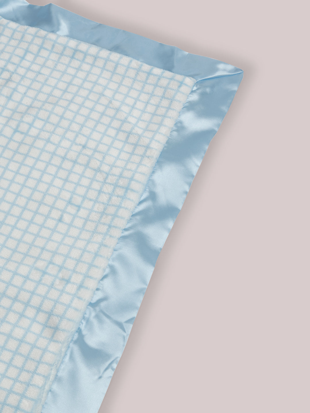 Mr. Happy Reversible Blanket showing reverse side and satin corner