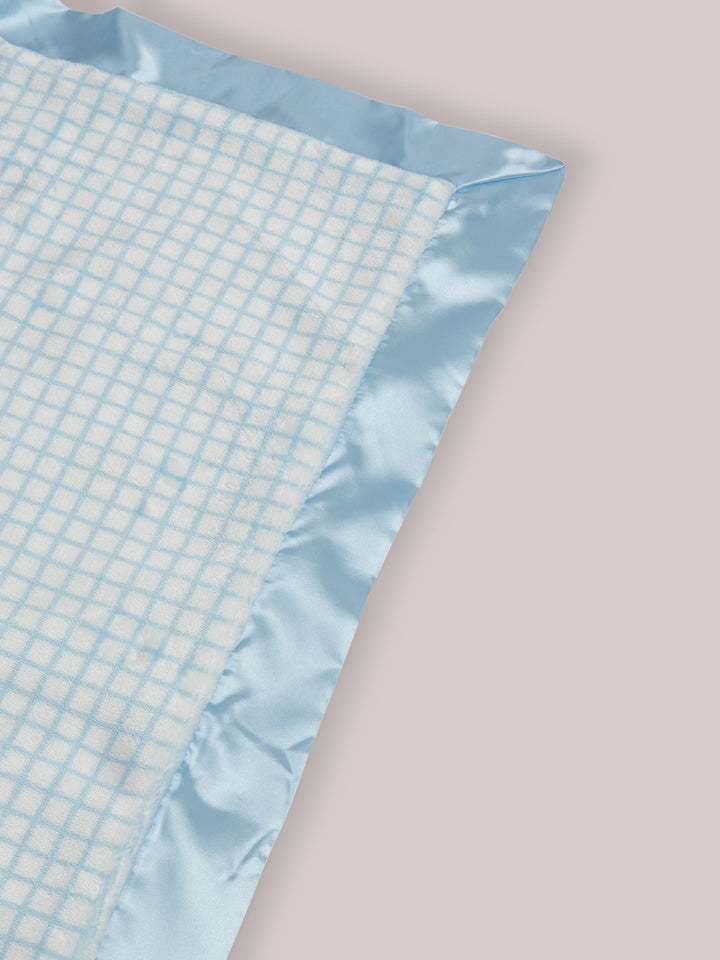 Mr. Happy Reversible Blanket showing reverse side and satin corner