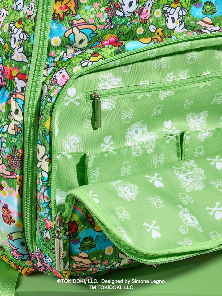 tokidoki x JuJuBe Zealous Diaper Bag Backpack in Meadow Blooms – close-up of front zippered pocket area
